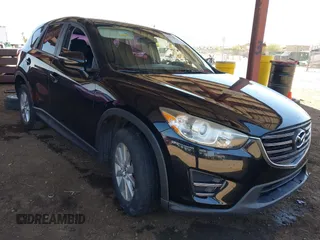 2016 Mazda CX-5 Sport with VIN JM3KE4BY8G0829002, listed as a IAAI auction lot 42553846 with 103,231 mi miles and . Bid and sale history available at DreamBid. Image 1.