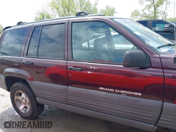 1997 Jeep Grand Cherokee Laredo with VIN 1J4GZ58S4VC702040, listed as a IAAI auction lot 42165536 with 121,803 mi miles and . Bid and sale history available at DreamBid. Image 14.