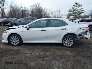 2020 Toyota Camry LE with VIN 4T1C11AK9LU912585, listed as a IAAI auction lot 41711816 with 142,751 mi miles. Bid and sale history available at carsss.com. Image 14.