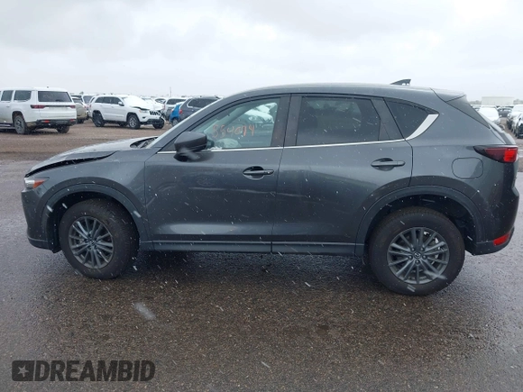 2021 Mazda CX-5 Touring with VIN JM3KFBCM8M0311433, listed as a IAAI auction lot 40554094 with 23,319 mi miles. Bid and sale history available at carsss.com. Image 14.