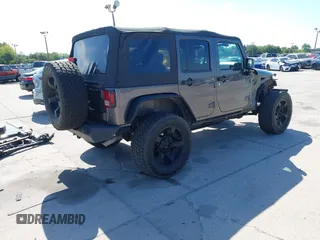 2014 Jeep Wrangler Unlimited Sport with VIN 1C4BJWDG4EL295044, listed as a IAAI auction lot 41997837 with 143,447 mi miles. Bid and sale history available at carsss.com. Image 4.
