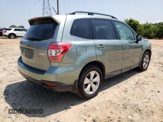 2014 Subaru Forester Touring with VIN JF2SJAMC4EH404204, listed as a Copart auction lot 60196965 with 200,292 mi miles and Salvage title. Bid and sale history available at DreamBid. Image 3.