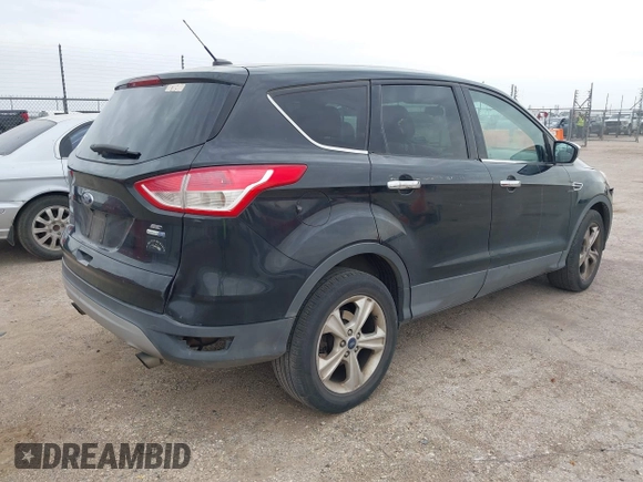 2015 Ford Escape SE with VIN 1FMCU9G90FUA54163, listed as a IAAI auction lot 42058788 with 130,623 mi miles. Bid and sale history available at carsss.com. Image 4.