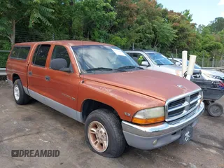 2000 Dodge Dakota Sport z VIN 1B7GL2AZ6YS634945, wystawiony jako IAAI lot #42335078 z przebiegiem 195 618 mil mil oraz . Historia ofert i sprzedaży dostępna na DreamBid. Obrazek 1.