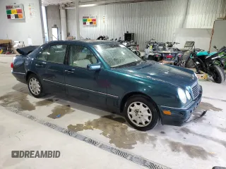 1998 Mercedes-Benz E-Class with VIN WDBJF65F6WA590094, listed as a Copart auction lot 72751984 with 196,048 mi miles and Salvage Title. Bid and sale history available at carsss.com. Image 4.
