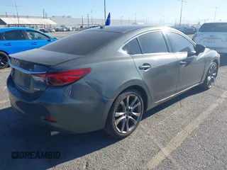 2017 Mazda 6 Grand Touring with VIN JM1GL1W51H1137470, listed as a IAAI auction lot 41872756 with 132,564 mi miles. Bid and sale history available at carsss.com. Image 4.