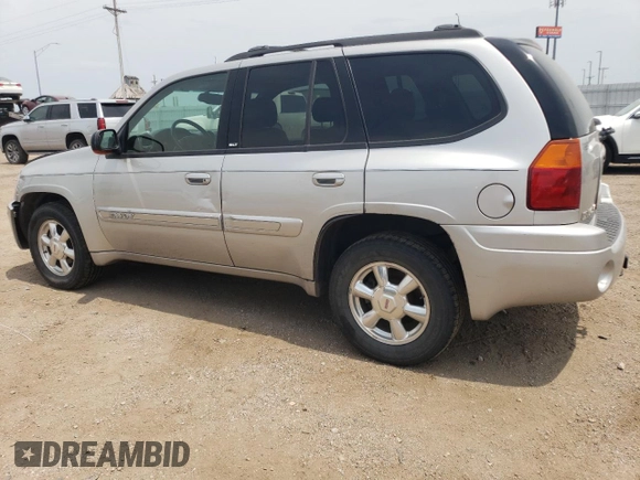 2004 GMC Envoy SLT with VIN 1GKDT13S842439635, listed as a Copart auction lot 63317194 with 201,672 mi miles and Salvage Title. Bid and sale history available at carsss.com. Image 2.