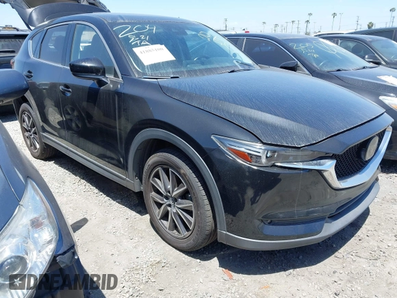 2018 Mazda CX-5 Grand Touring with VIN JM3KFADM4J0326760, listed as a IAAI auction lot 41885100 with 82,091 mi miles and . Bid and sale history available at DreamBid. Image 1.