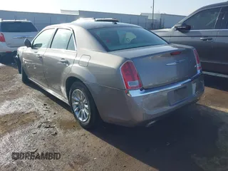 2014 Chrysler 300 with VIN 2C3CCAAG4EH159911, listed as a IAAI auction lot 41963042 with 105,972 mi miles and . Bid and sale history available at DreamBid. Image 3.