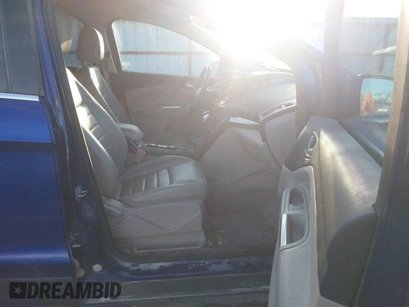 2014 Ford Escape Titanium with VIN 1FMCU9JX4EUD30964, listed as a IAAI auction lot 41772153 with 179,481 mi miles and . Bid and sale history available at DreamBid. Image 5.