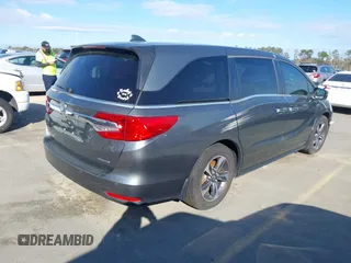 2020 Honda Odyssey Touring z VIN 5FNRL6H8XLB035047, wystawiony jako IAAI lot #41794343 z przebiegiem 57 537 mil mil oraz . Historia ofert i sprzedaży dostępna na DreamBid. Obrazek 4.