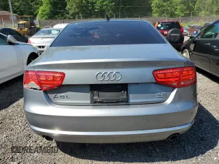 2012 Audi A8 z VIN WAURVAFDXCN001167, wystawiony jako Copart lot #57227105 z przebiegiem 154 409 mil mil oraz Szkoda całkowita • Salvage title. Historia ofert i sprzedaży dostępna na DreamBid. Obrazek 6.