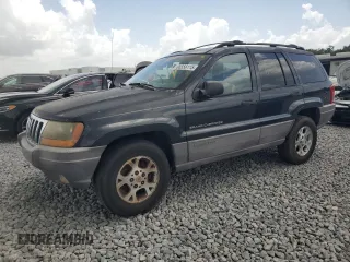 1999 Jeep Grand Cherokee Laredo z VIN 1J4G258S4XC577449, wystawiony jako Copart lot #66556115 z przebiegiem 220 256 mil mil oraz Czysty tytuł • Clean title. Historia ofert i sprzedaży dostępna na DreamBid. Obrazek 1.