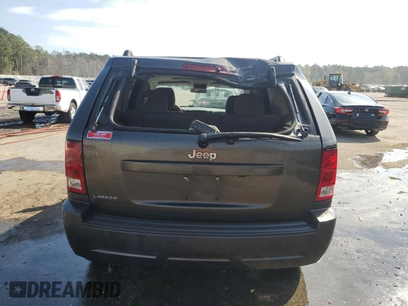 2006 Jeep Grand Cherokee Laredo with VIN 1J4HS48N96C357909, listed as a Copart auction lot 77551154 with 136,235 mi miles and Salvage Title. Bid and sale history available at carsss.com. Image 6.