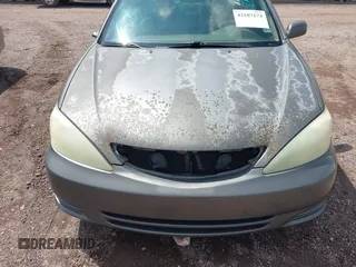 2004 Toyota Camry LE with VIN 4T1BE30K24U921028, listed as a IAAI auction lot 42187174 with 295,174 mi miles and . Bid and sale history available at DreamBid. Image 13.