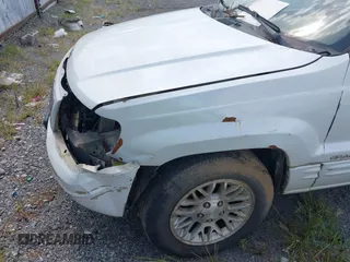 2002 Jeep Grand Cherokee Limited z VIN 1J4GX58N62C195783, wystawiony jako IAAI lot #42745397 z przebiegiem 242 502 mil mil oraz . Historia ofert i sprzedaży dostępna na DreamBid. Obrazek 13.