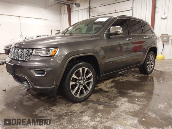 2017 Jeep Grand Cherokee Overland z VIN 1C4RJFCG6HC641812, wystawiony jako IAAI lot #42053404 z przebiegiem 129 184 mil mil oraz . Historia ofert i sprzedaży dostępna na DreamBid. Obrazek 2.