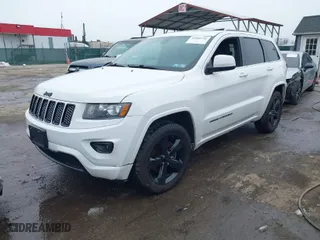 2015 Jeep Grand Cherokee Altitude with VIN 1C4RJFAG7FC954853, listed as a IAAI auction lot 40988796 with 107,002 mi miles. Bid and sale history available at carsss.com. Image 2.