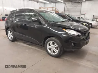 2013 Hyundai Tucson GLS with VIN KM8JU3AC8DU557445, listed as a IAAI auction lot 41839782 with 153,769 mi miles. Bid and sale history available at carsss.com. Image 1.