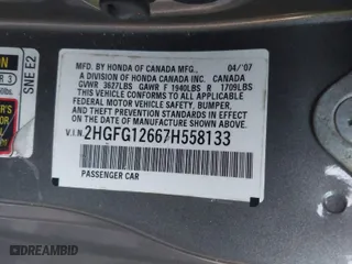 2007 Honda Civic Cpe LX with VIN 2HGFG12667H558133, listed as a IAAI auction lot 41203439 with 220,144 mi miles. Bid and sale history available at carsss.com. Image 9.