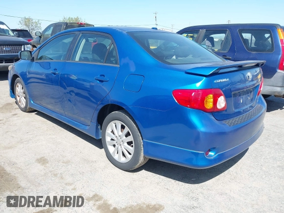2009 Toyota Corolla with VIN 1NXBU40E49Z022648, listed as a IAAI auction lot 42042633 with 134,628 mi miles. Bid and sale history available at carsss.com. Image 3.