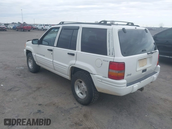 1998 Jeep Grand Cherokee Laredo with VIN 1J4GZ48S3WC204990, listed as a IAAI auction lot 41704176 with 185,376 mi miles. Bid and sale history available at carsss.com. Image 3.