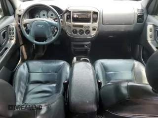 2004 Ford Escape Limited with VIN 1FMCU04164KB51256, listed as a Copart auction lot 58969565 with 137,360 mi miles and Salvage title. Bid and sale history available at DreamBid. Image 8.