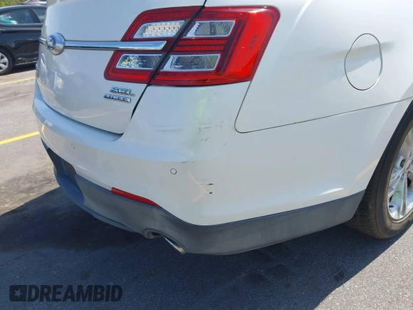 2014 Ford Taurus SEL with VIN 1FAHP2E86EG132676, listed as a IAAI auction lot 41943392 with 183,633 mi miles. Bid and sale history available at carsss.com. Image 14.