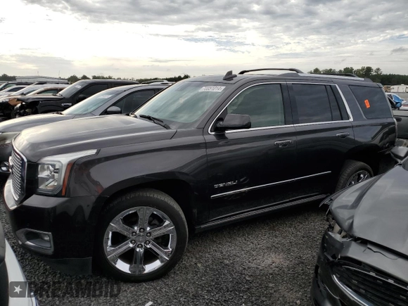2017 GMC Yukon Denali with VIN 1GKS2CKJ3HR360319, listed as a Copart auction lot 70051014 with 127,896 mi miles and Salvage Title. Bid and sale history available at carsss.com. Image 1.