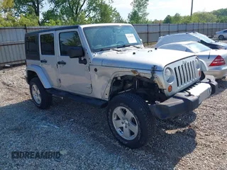 2012 Jeep Wrangler Unlimited Altitude with VIN 1C4HJWEGXCL120397, listed as a IAAI auction lot 42219976 with 119,172 mi miles and . Bid and sale history available at DreamBid. Image 1.