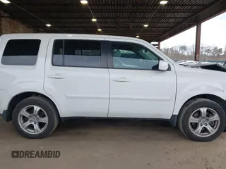 2014 Honda Pilot EX-L with VIN 5FNYF4H59EB047609, listed as a IAAI auction lot 42071353 with 148,661 mi miles and . Bid and sale history available at carsss.com. Image 12.