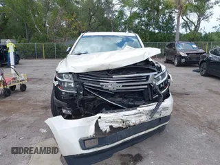 2015 Chevrolet Suburban LTZ with VIN 1GNSKKKC4FR687923, listed as a IAAI auction lot 42192062 with 139,873 mi miles and . Bid and sale history available at DreamBid. Image 12.