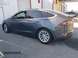 2018 Tesla Model X 75D with VIN 5YJXCDE28JF142509, listed as a IAAI auction lot 41993444 with 100,244 mi miles and . Bid and sale history available at carsss.com. Image 14.