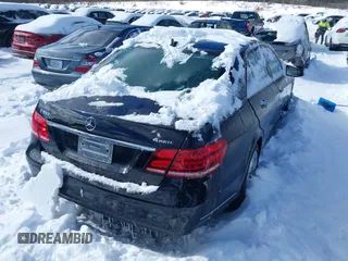 2014 Mercedes-Benz E-Class E 350 Luxury with VIN WDDHF8JB7EB069253, listed as a IAAI auction lot 41571265 with 174,699 mi miles. Bid and sale history available at carsss.com. Image 4.