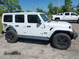 2020 Jeep Wrangler Unlimited Sahara with VIN 1C4HJXEN4LW330867, listed as a IAAI auction lot 41790709 with 63,151 mi miles. Bid and sale history available at carsss.com. Image 13.