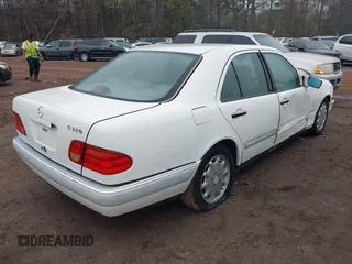 1997 Mercedes-Benz E-Class with VIN WDBJF55F4VA424262, listed as a IAAI auction lot 41462993 with 1 mi miles. Bid and sale history available at carsss.com. Image 4.