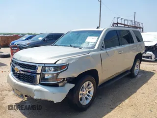 2015 Chevrolet Tahoe LS with VIN 1GNSCAKC9FR294832, listed as a IAAI auction lot 39274877 with 126,932 mi miles and . Bid and sale history available at DreamBid. Image 2.