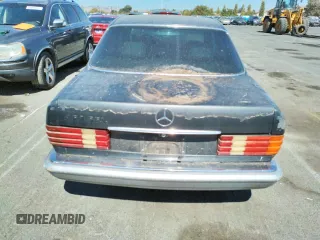 1986 Mercedes-Benz 420 with VIN WDBCA35DXGA210633, listed as a Copart auction lot 69728644 with 177,870 mi miles and Salvage Title. Bid and sale history available at carsss.com. Image 6.