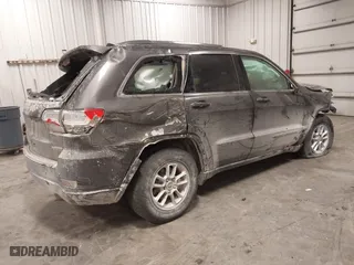 2018 Jeep Grand Cherokee Laredo E with VIN 1C4RJFAG4JC313054, listed as a IAAI auction lot 41469450 with 142,929 mi miles. Bid and sale history available at carsss.com. Image 4.