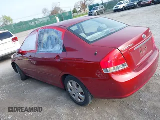 2009 Kia Spectra EX with VIN KNAFE221095634712, listed as a IAAI auction lot 41930897 with 165,185 mi miles. Bid and sale history available at carsss.com. Image 3.