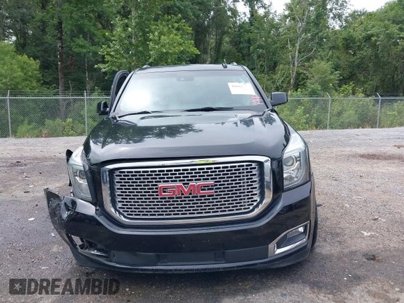 2016 GMC Yukon Denali with VIN 1GKS1CKJXGR254306, listed as a IAAI auction lot 39953539 with 164,149 mi miles. Bid and sale history available at carsss.com. Image 12.