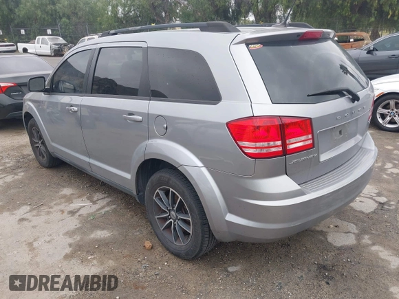 2018 Dodge Journey SE with VIN 3C4PDCAB1JT141295, listed as a IAAI auction lot 42098218 with 110,691 mi miles. Bid and sale history available at carsss.com. Image 3.