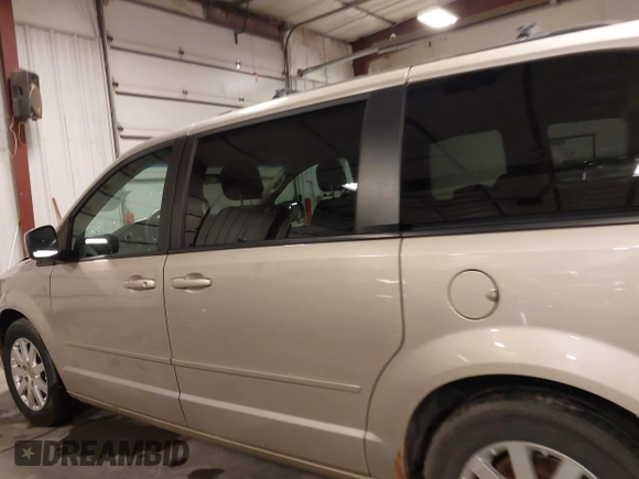 2013 Dodge Grand Caravan SXT with VIN 2C4RDGCG0DR567186, listed as a IAAI auction lot 41706119 with 112,512 mi miles and . Bid and sale history available at DreamBid. Image 15.