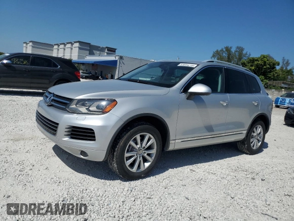 2014 Volkswagen Touareg Sport with VIN WVGEF9BP8ED005445, listed as a Copart auction lot 53694215 with 194,711 mi miles and Salvage Title. Bid and sale history available at DreamBid. Image 1.