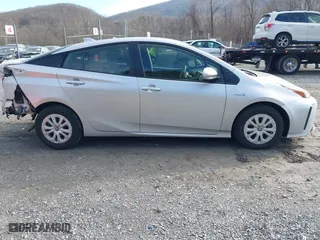 2021 Toyota Prius L Eco with VIN JTDKAMFU7M3143961, listed as a IAAI auction lot 41486032 with 58,979 mi miles. Bid and sale history available at carsss.com. Image 13.