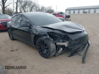2021 Tesla Model 3 Performance with VIN 5YJ3E1EC5MF030822, listed as a IAAI auction lot 41907973 with 50,133 mi miles and . Bid and sale history available at carsss.com. Image 1.