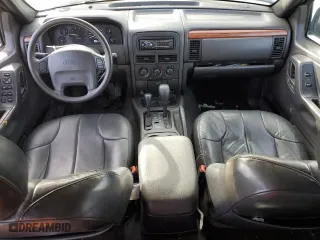 1999 Jeep Grand Cherokee Laredo with VIN 1J4GW58S0XC653687, listed as a Copart auction lot 81166844 with 252,330 mi miles and Salvage Title. Bid and sale history available at carsss.com. Image 8.