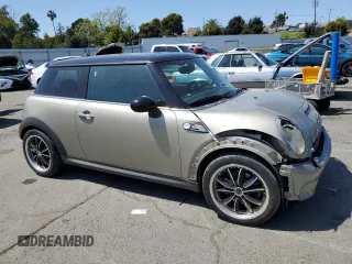 2009 MINI Hardtop S with VIN WMWMF73549TT94143, listed as a Copart auction lot 52120615 with 144,334 mi miles and Salvage Title. Bid and sale history available at DreamBid. Image 4.