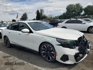 2024 BMW i5 eDrive40 with VIN WBY33FK04RCR92576, listed as a Copart auction lot 51180875 with 11,289 mi miles and Salvage title. Bid and sale history available at DreamBid. Image 4.