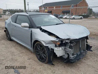 2014 Scion tC with VIN JTKJF5C73E3075699, listed as a IAAI auction lot 41513021 with 154,399 mi miles. Bid and sale history available at carsss.com. Image 1.
